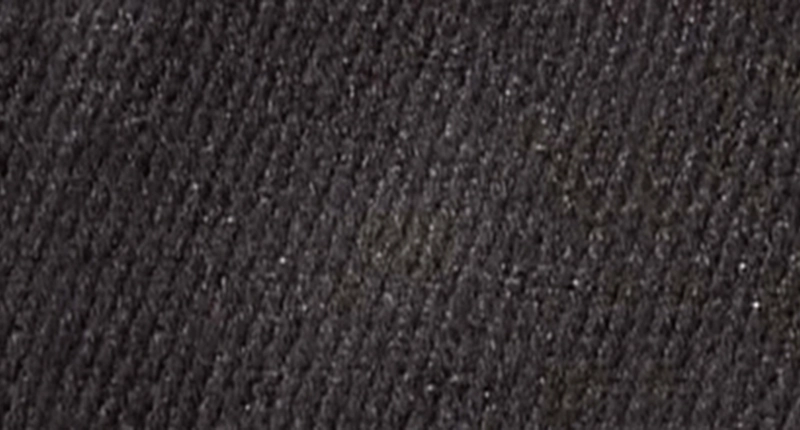 After image of burn mark in black fabric car interior