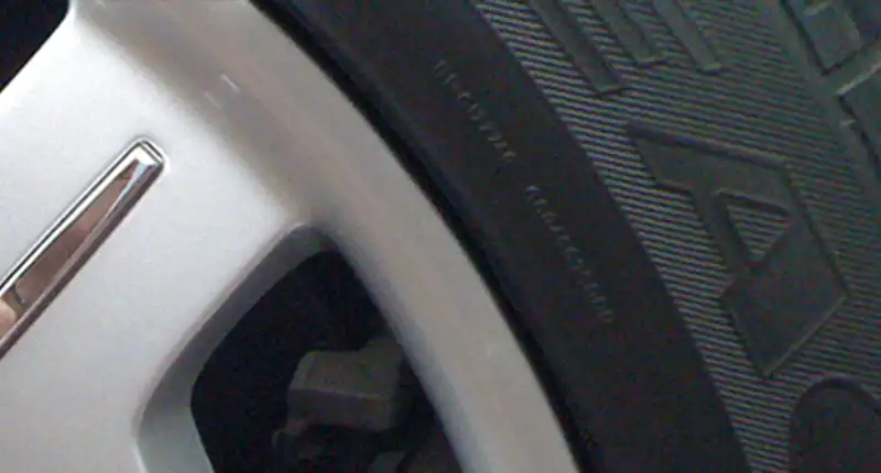 Closeup of a painted alloy wheel after a repair.