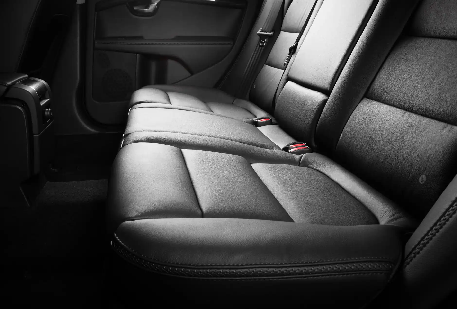 Shiny black leather car interior.