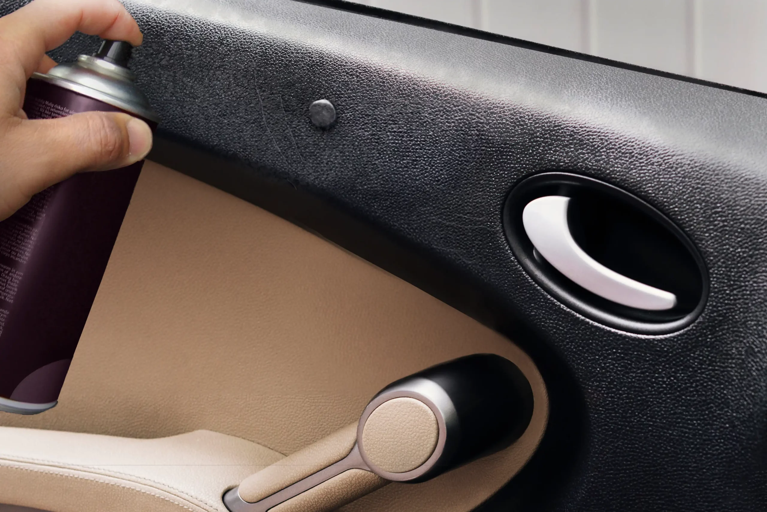 A technician removing minor scratches and discoloration on plastic car interior.