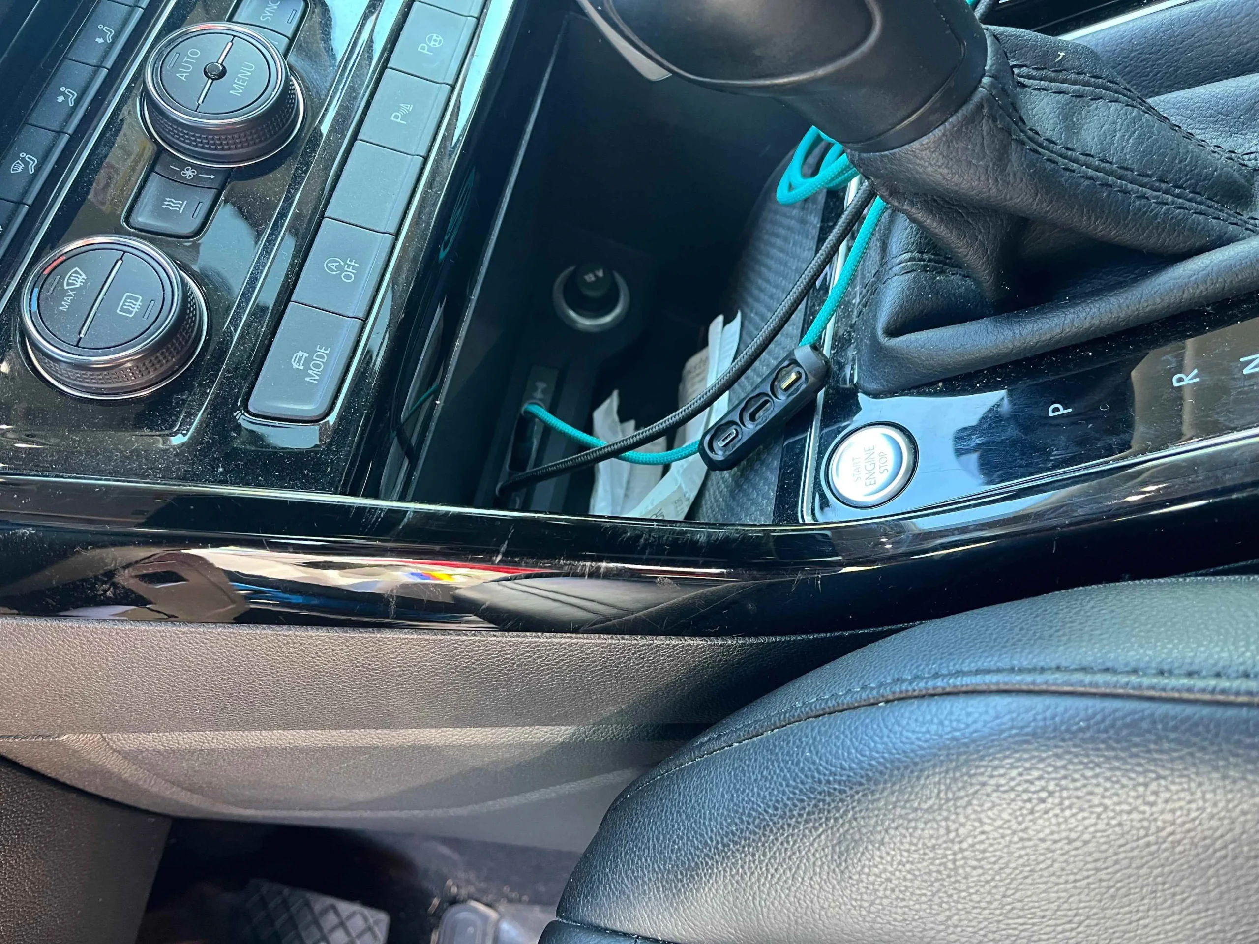 Damage to the plastic interior of a car between the two front seats