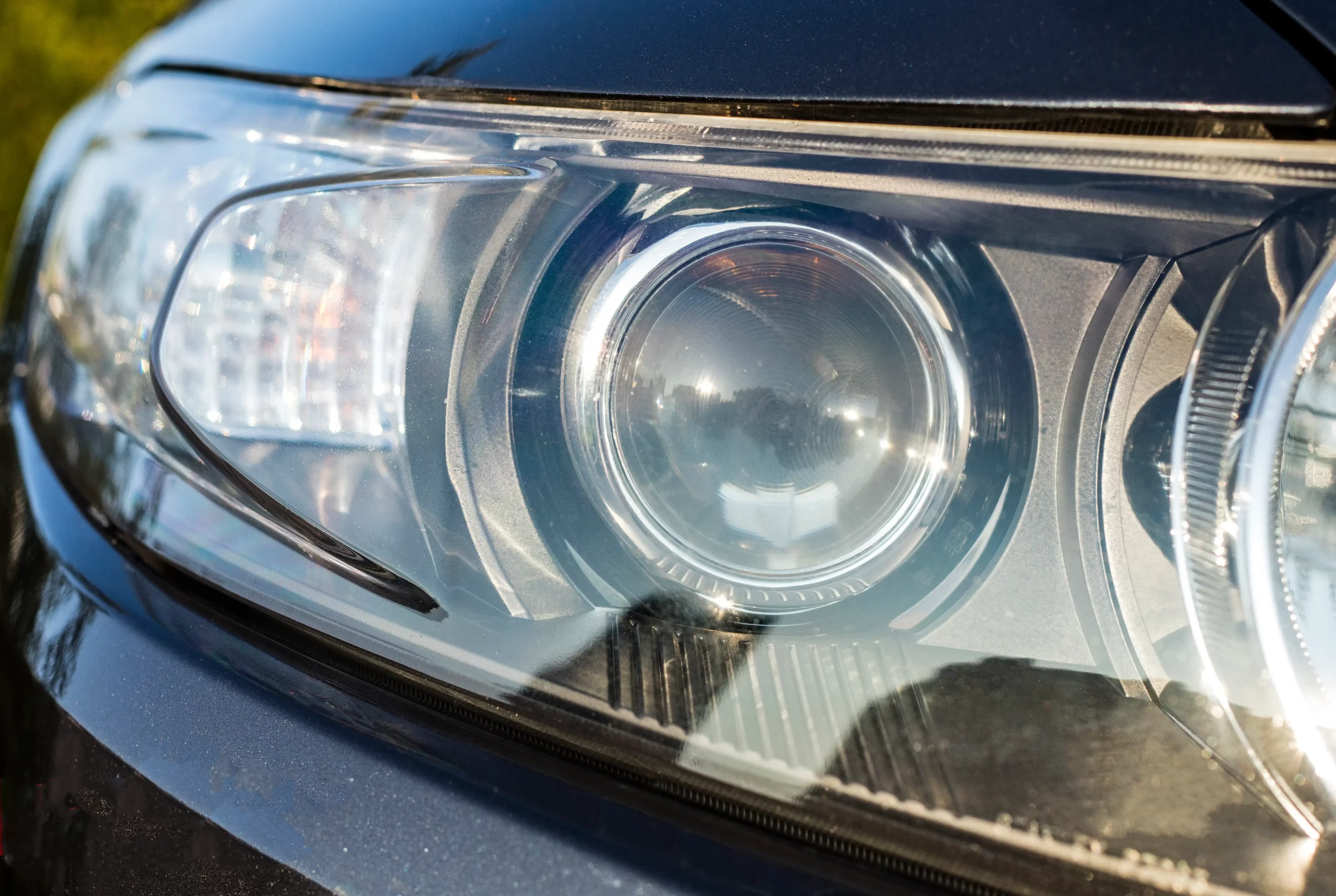 Closeup of a headlight after a headlight polish.