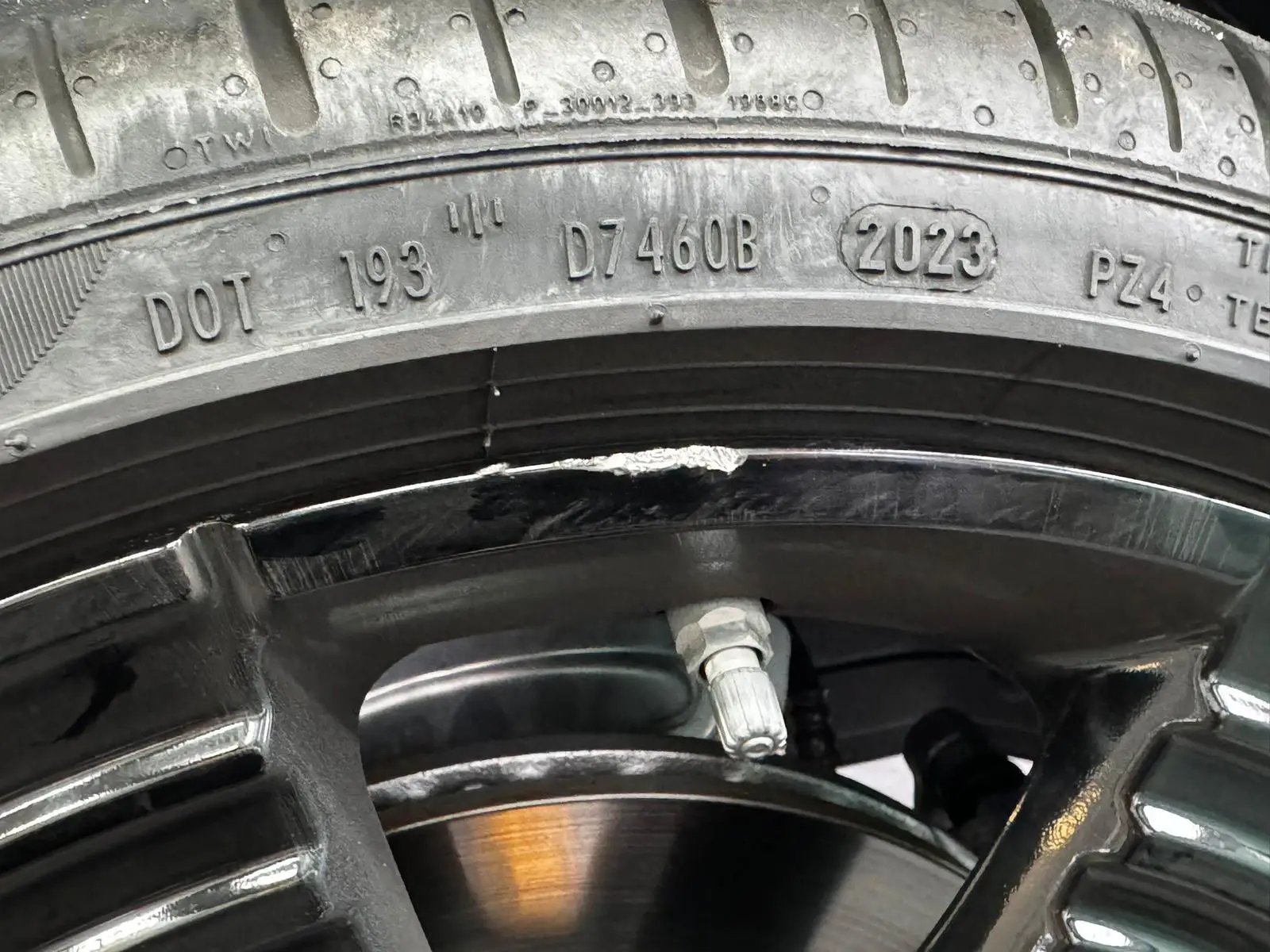 Scratched alloy wheel that needs to be repaired and painted again