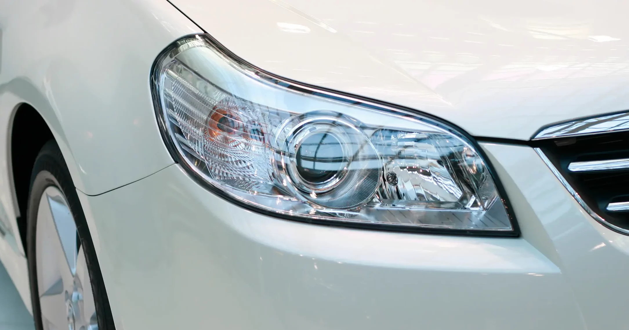 Closeup of shiny car headlights.