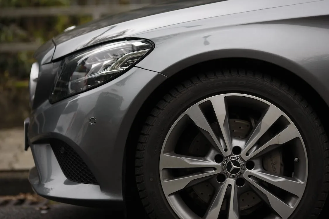 Grey car with close up og alloy wheels.